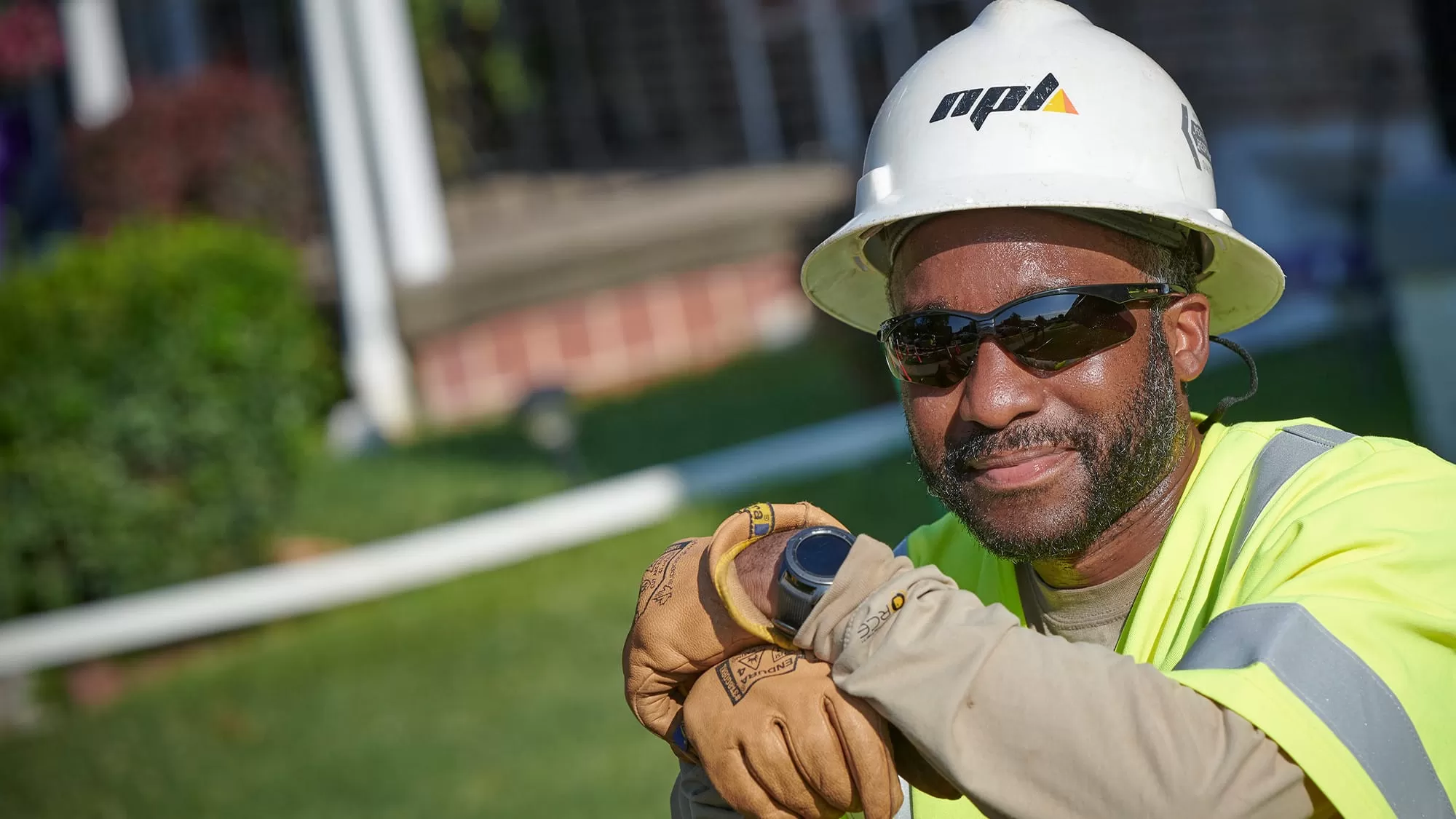 npl worker smiling at the camera