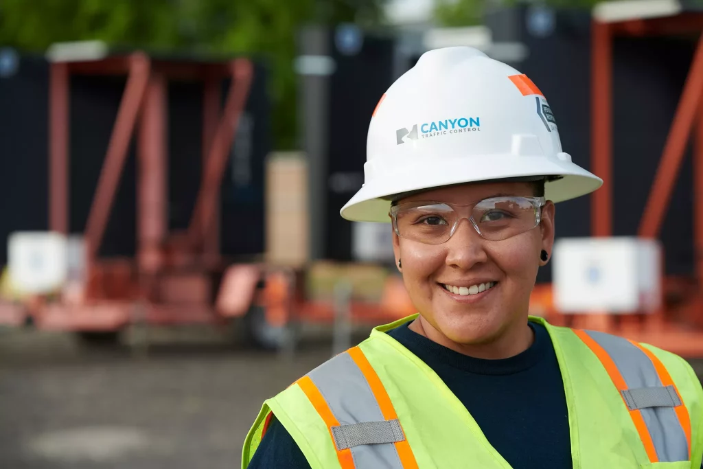 Canyon Pipeline worker smiling for the camera on a work site